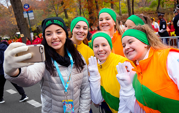 Group of Senior Girl Scouts outdoors at an event smiling 